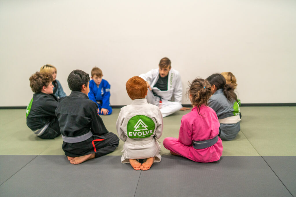 Instructors Teaching Kids about Brazilian Jiu Jitsu